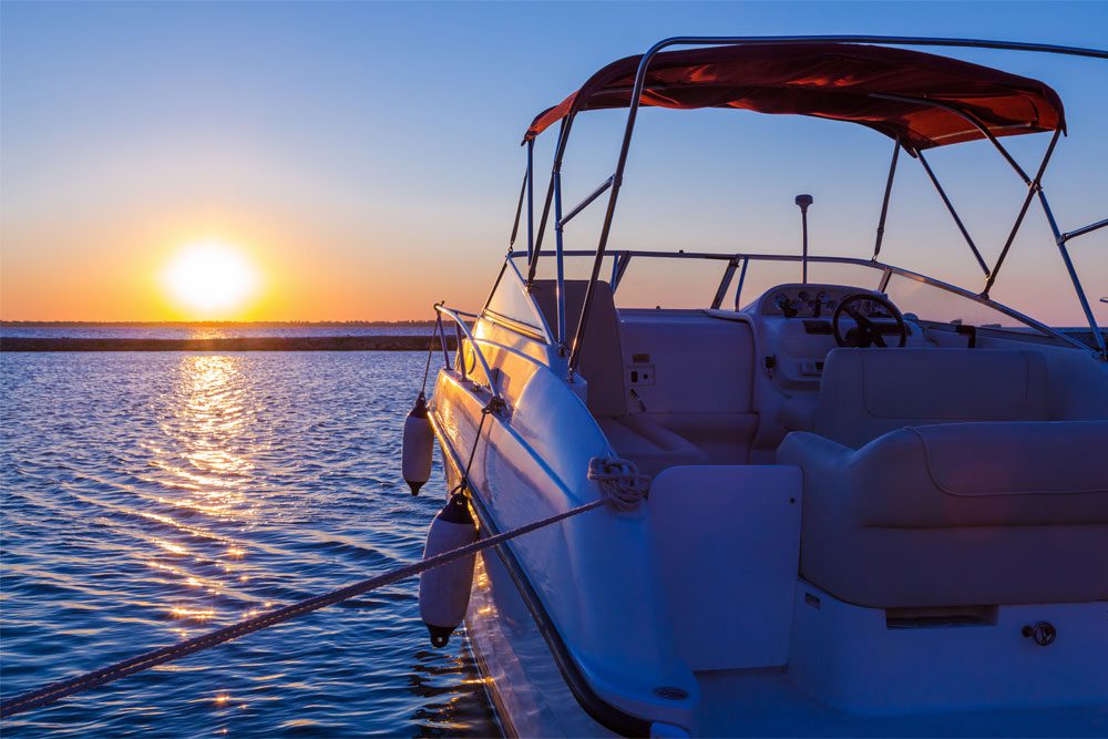 Image of a boat moored at sunset