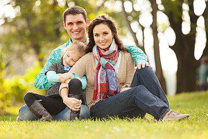 Family Sitting in Park
