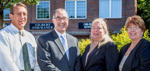 Photo of Gilbert Insurance agents standing in front of business