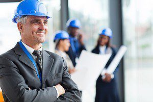 Photo of architects wearing blue hard hats