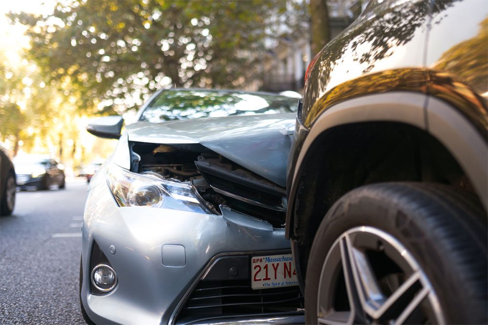 Gilbert-Blog-Featured-Image-New-Massachusetts-Compulsory-Auto-Insurance-Limits Image of two cars in an accident
