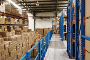 Photo of boxes stacked inside a warehouse