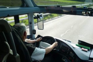 Photo of a man in the cab of a commercial vehicle