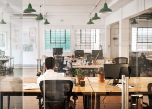 Photo of a lone person in an empty office
