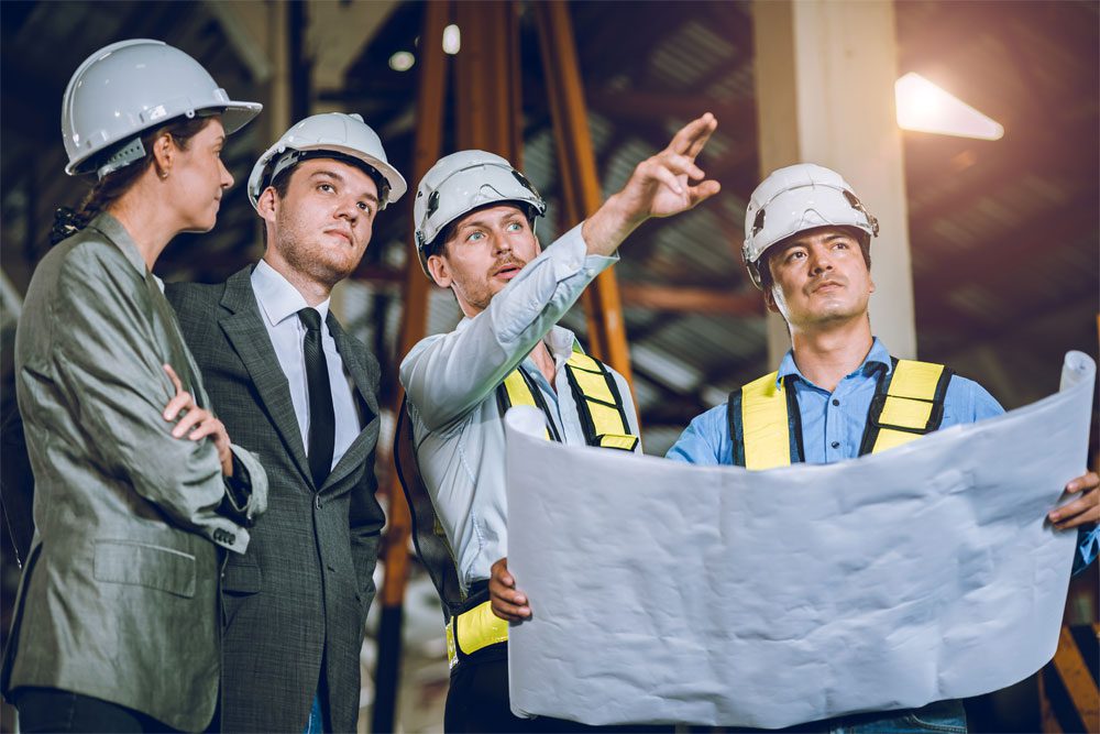 Gilbert-Blog-Featured-Image-Emerging-Business-Risks-2026 Image of engineers discussing a project